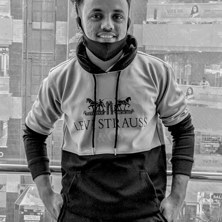 Kaveri Mehta, Lead Design Curator at Sunlit Maple Crest, reviewing corporate floral arrangements